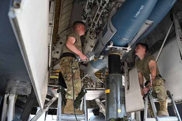 Members of the 28th Aircraft Maintenance Squadron weapons load crew insert an inert joint air-to-surface standoff missile into a B-1B Lancer. Virtualitics